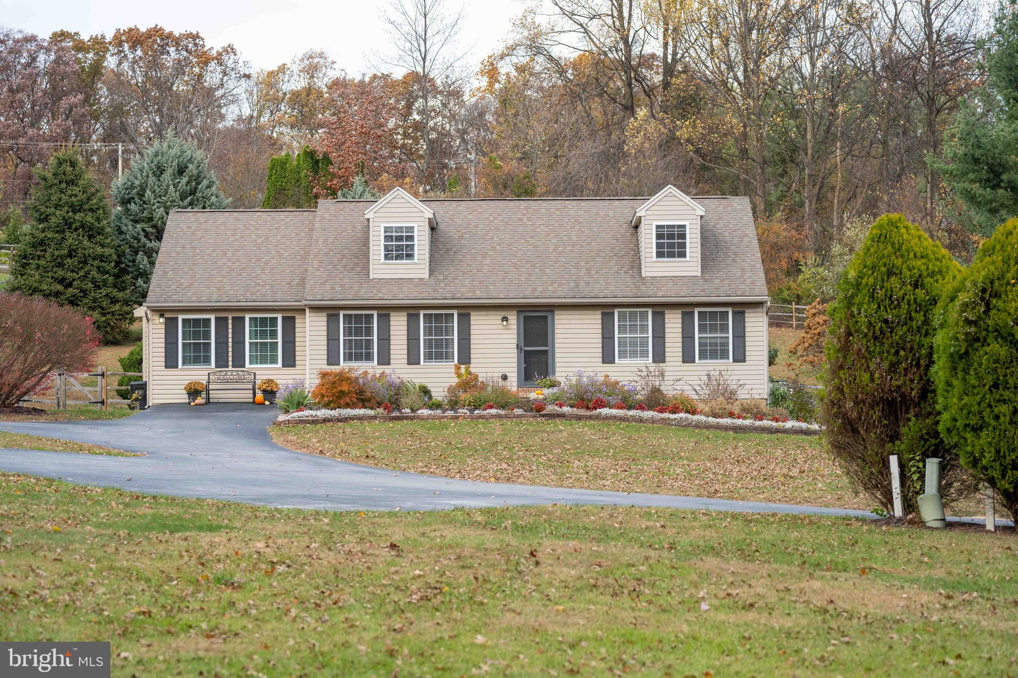 151 South Sandy Hill Road Coatesville, PA 19320 - Photo 42 of 91 a front view of a house with a garden and trees