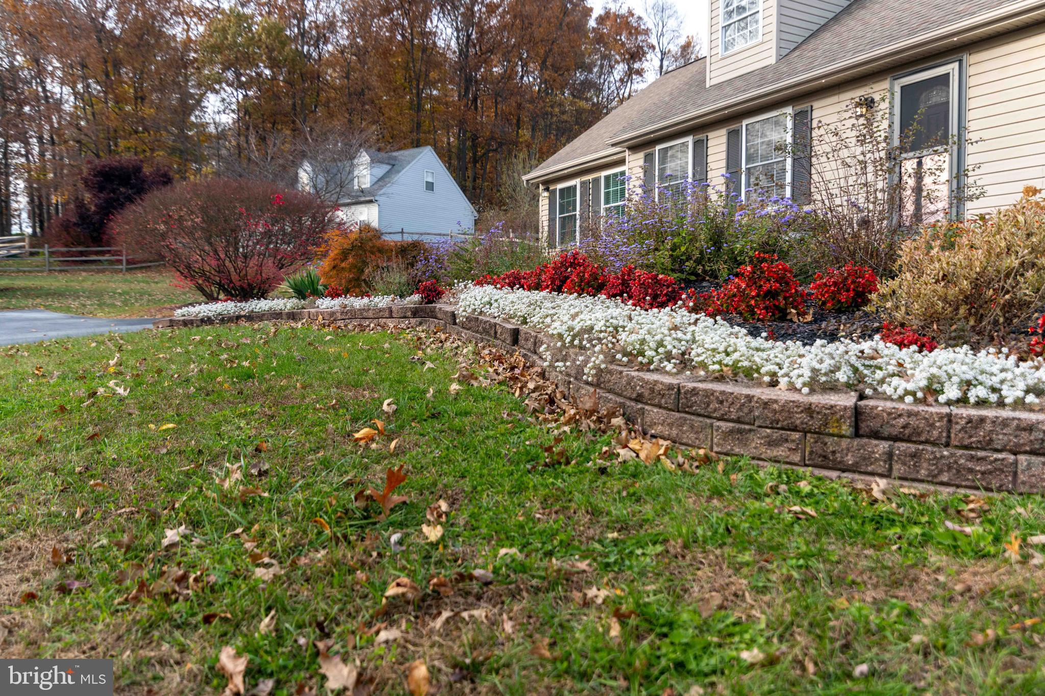 151 South Sandy Hill Road Coatesville, PA 19320 - Photo 65 of 91 a front view of a house with a yard and fountain