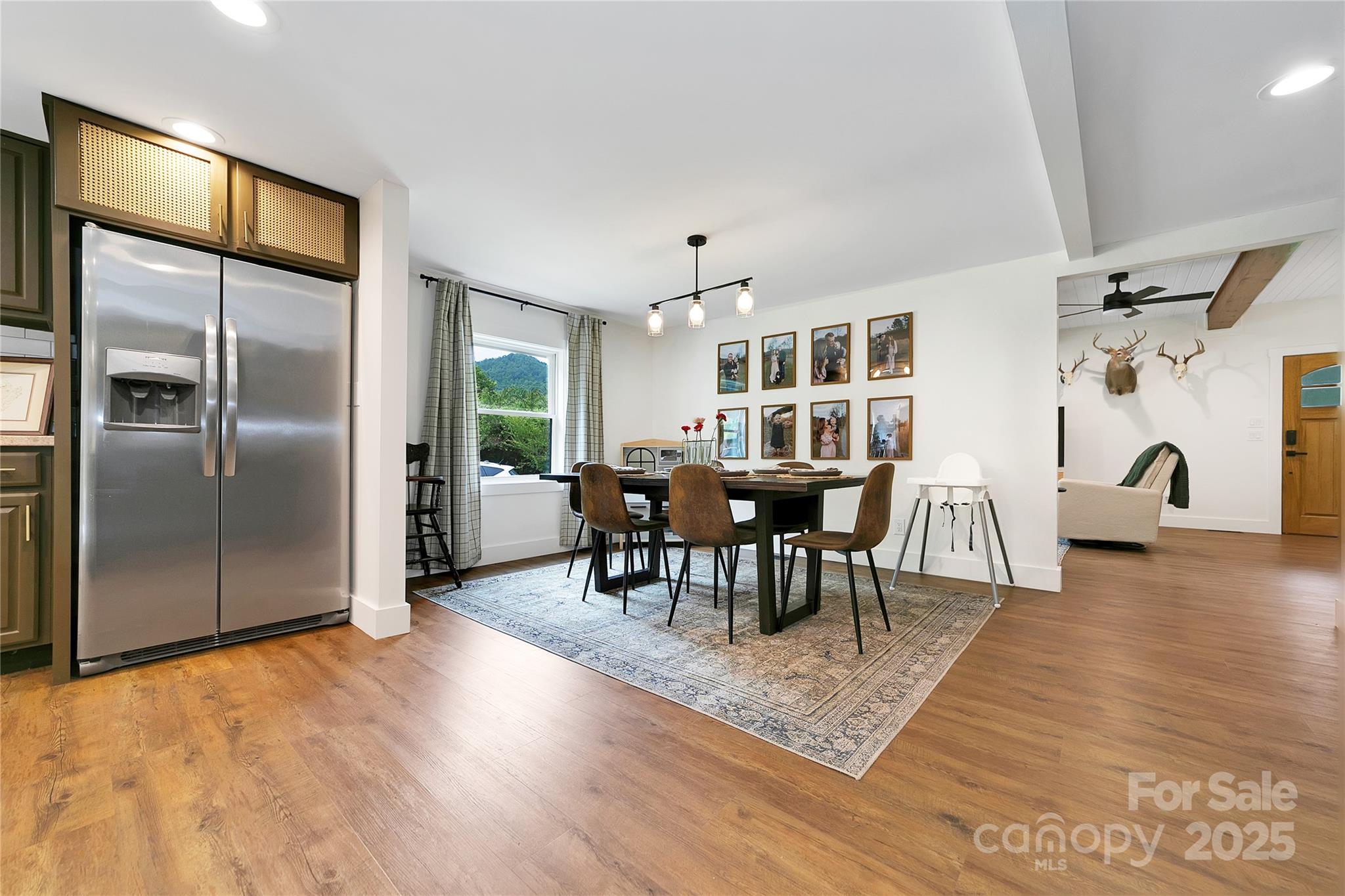 903 Middlefork Road Brevard, NC 28712 - Photo 11 of 45 a view of a dining room with furniture window and wooden floor