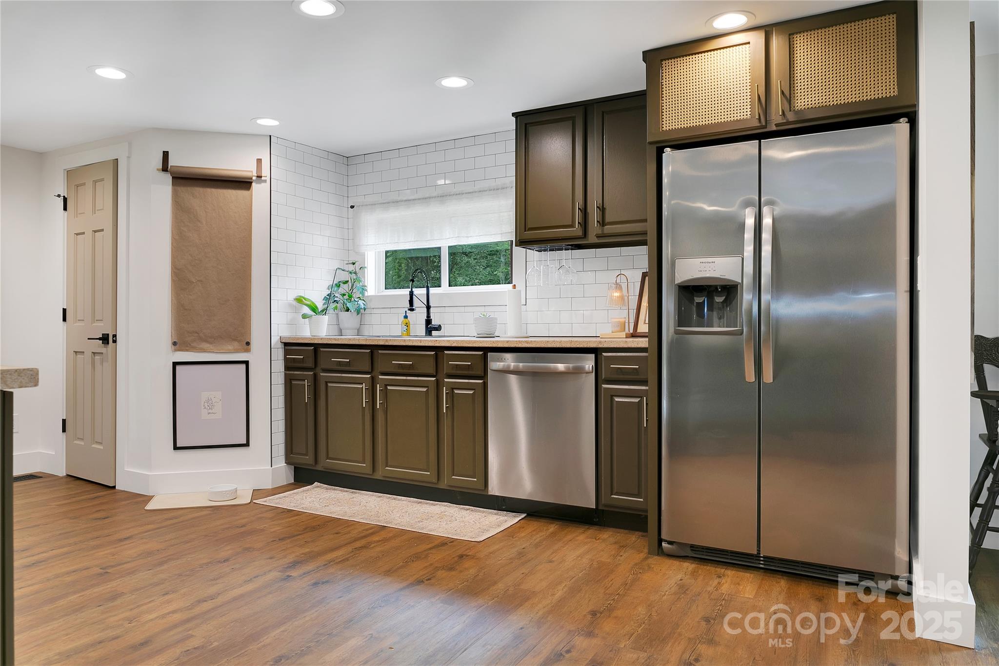903 Middlefork Road Brevard, NC 28712 - Photo 13 of 45 a kitchen with stainless steel appliances granite countertop a refrigerator a sink a stove and island