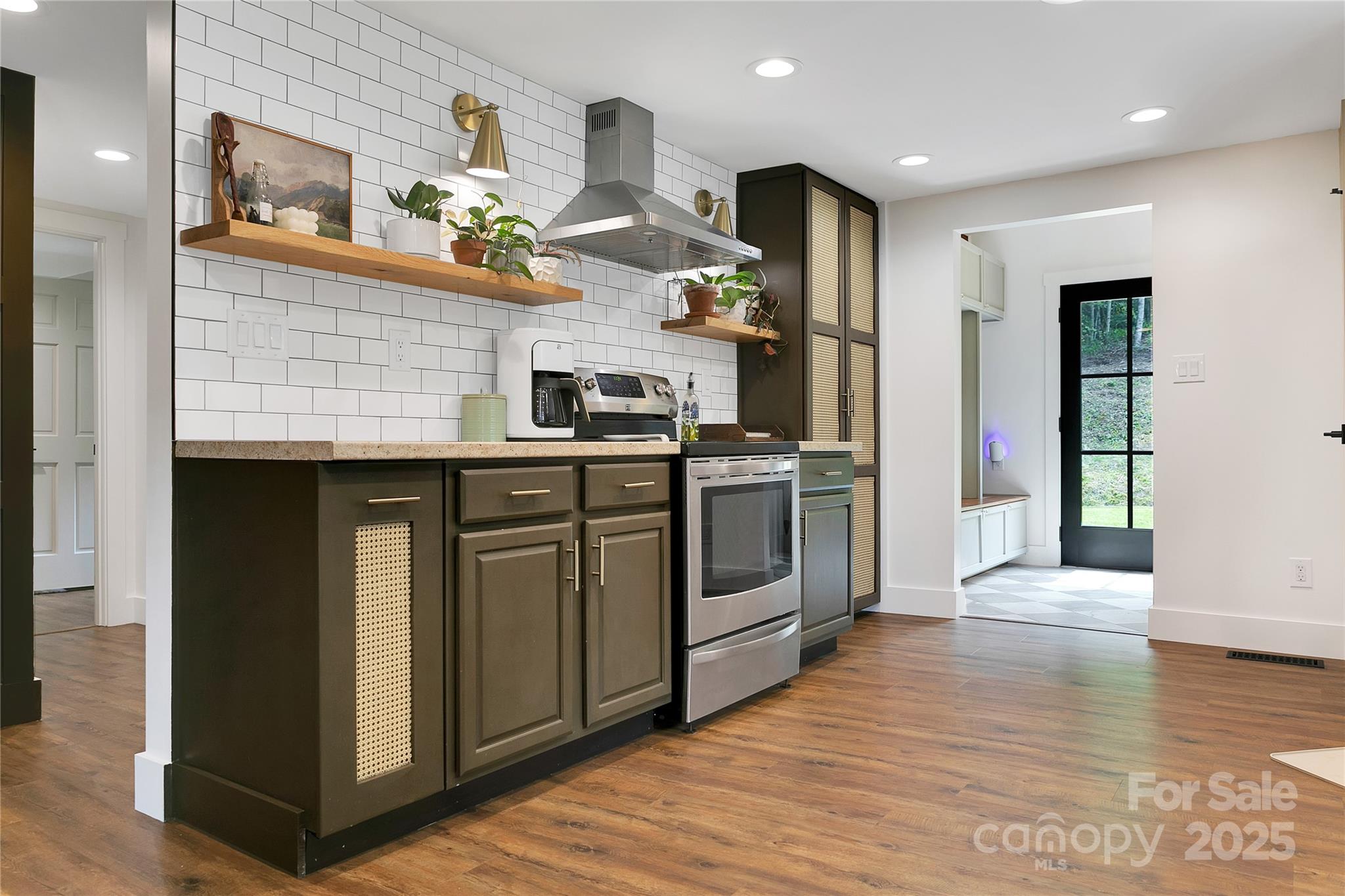 903 Middlefork Road Brevard, NC 28712 - Photo 15 of 45 a kitchen with stainless steel appliances granite countertop a stove a sink and a refrigerator