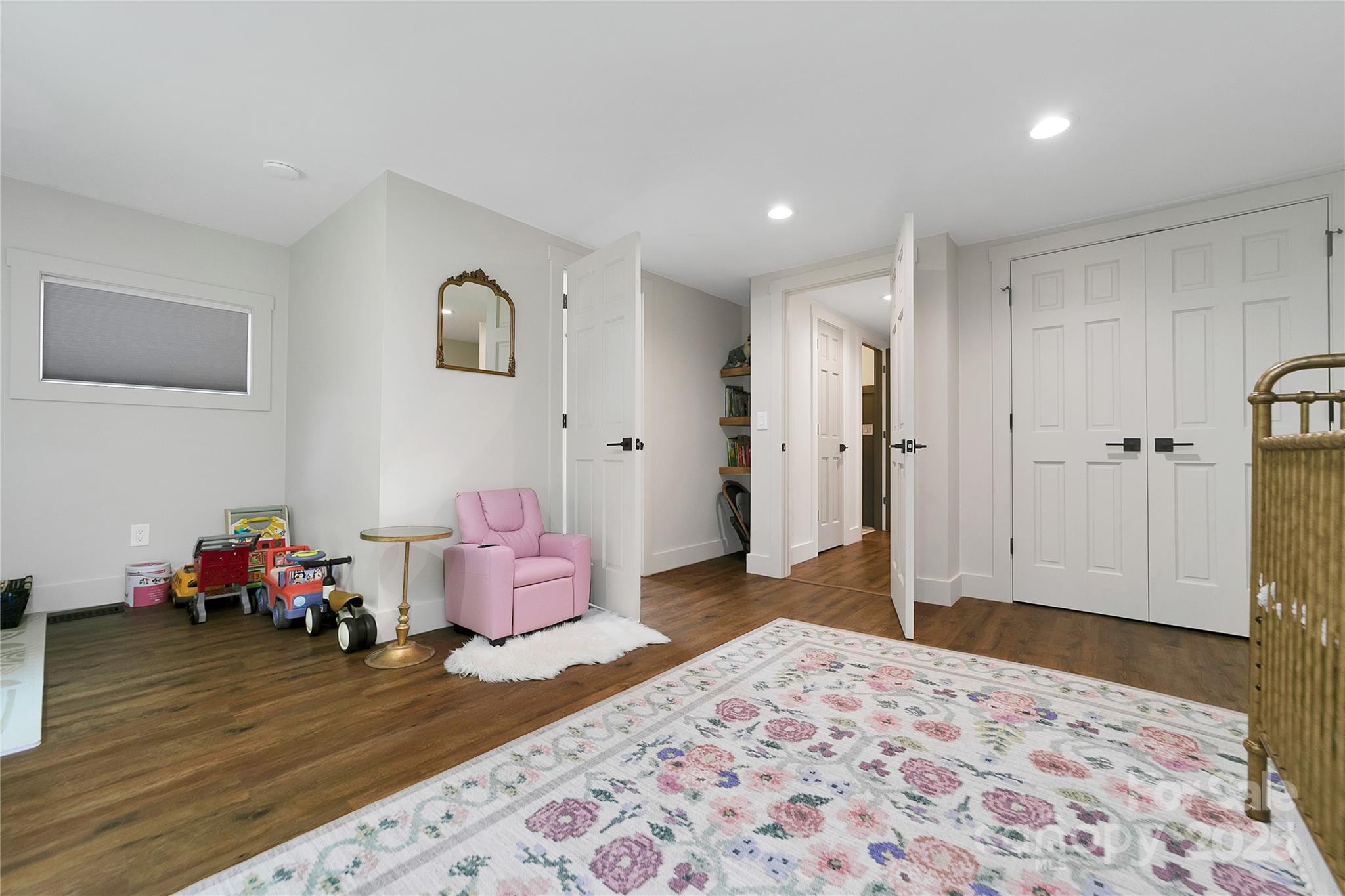 903 Middlefork Road Brevard, NC 28712 - Photo 20 of 45 a bedroom with a bed and wooden floor