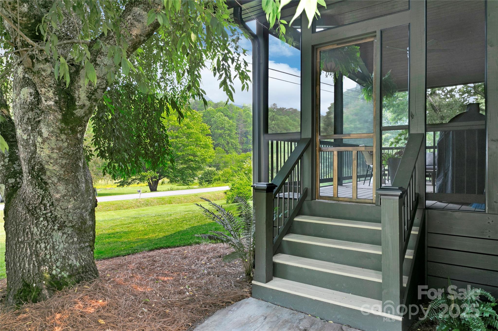 903 Middlefork Road Brevard, NC 28712 - Photo 2 of 45 a view of a garden from a balcony