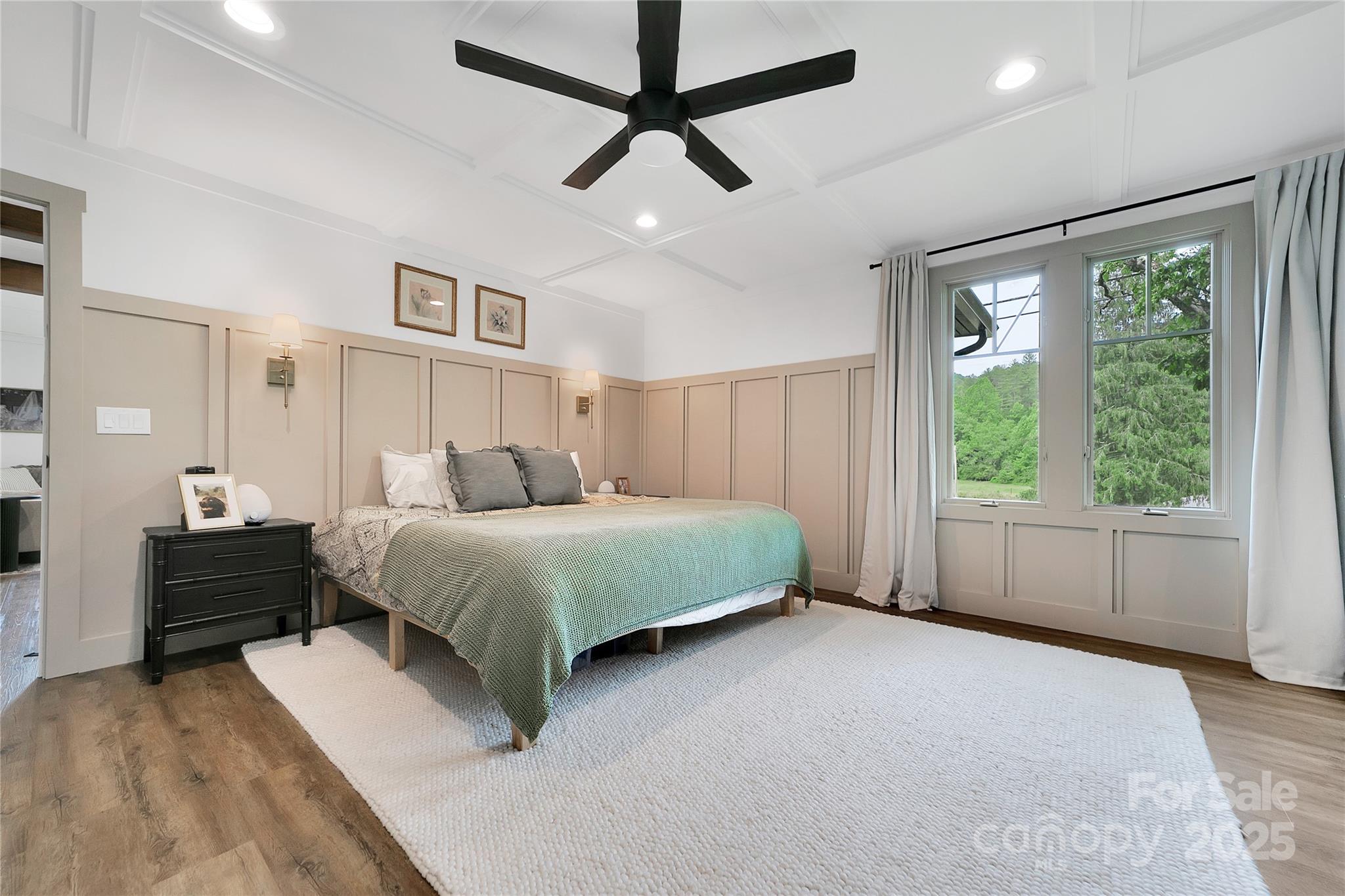 903 Middlefork Road Brevard, NC 28712 - Photo 24 of 45 a bedroom with a large bed and a large window