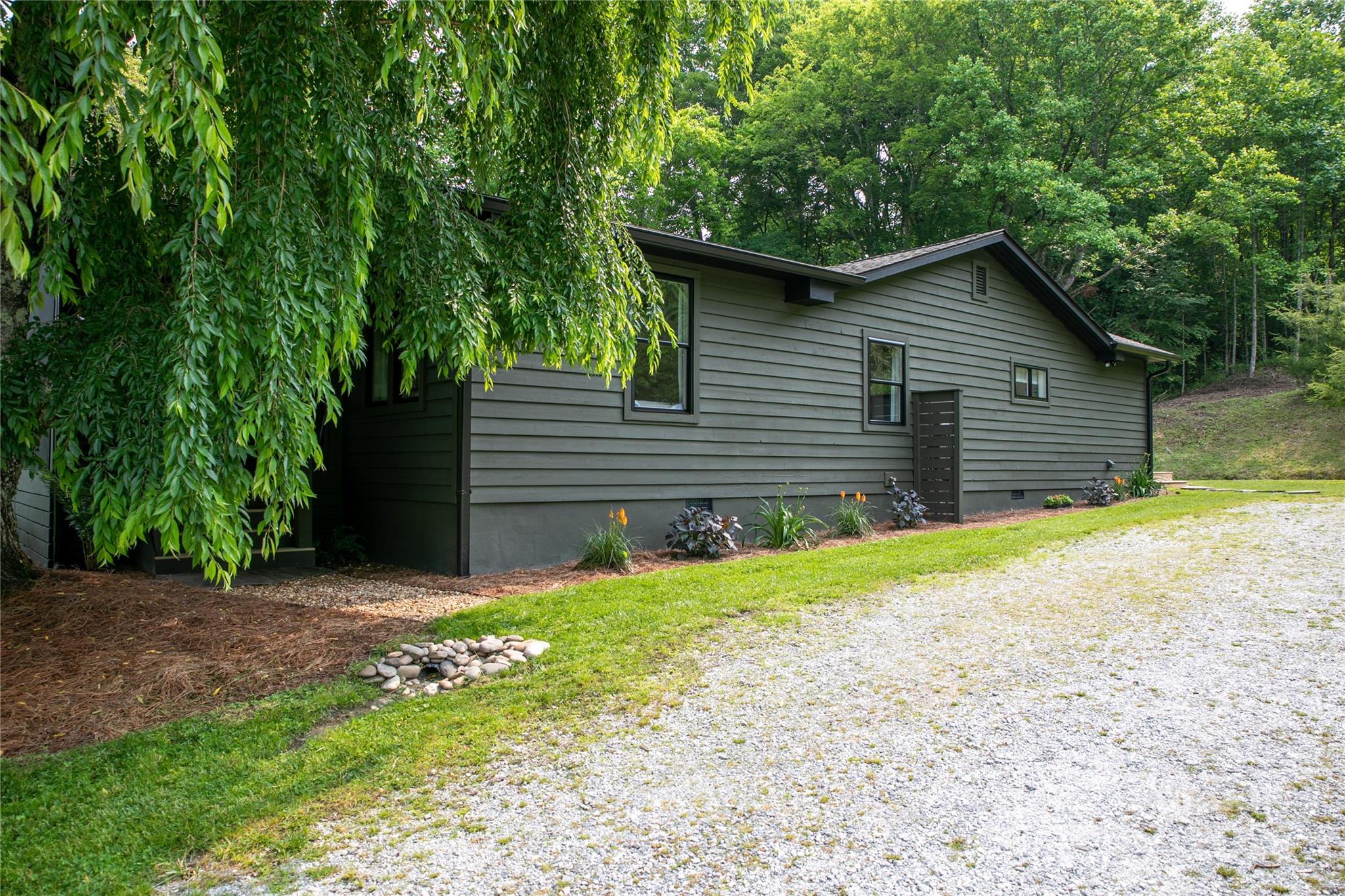 903 Middlefork Road Brevard, NC 28712 - Photo 34 of 45 a front view of a house with garden