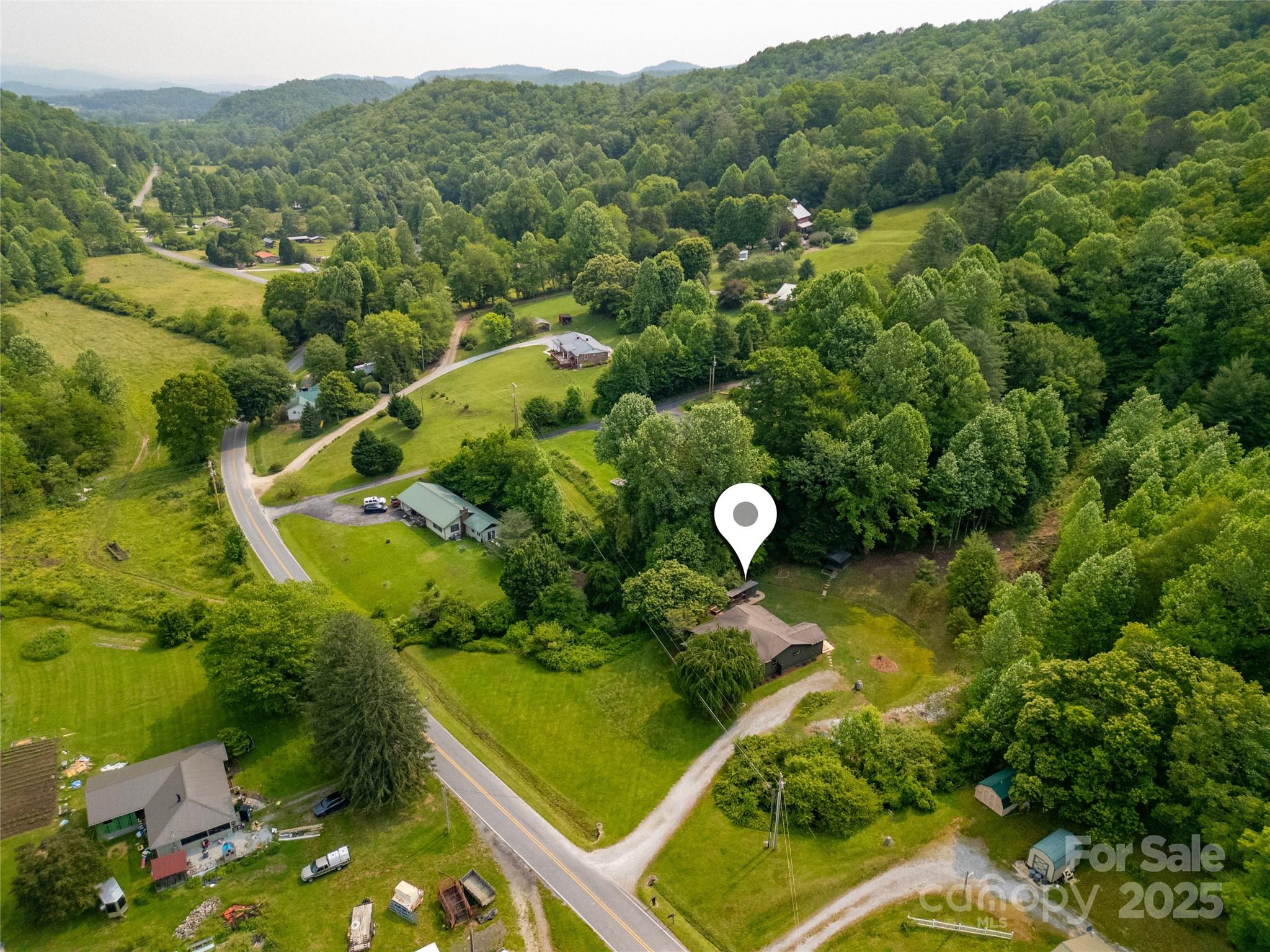903 Middlefork Road Brevard, NC 28712 - Photo 40 of 45 an aerial view of a forest with houses