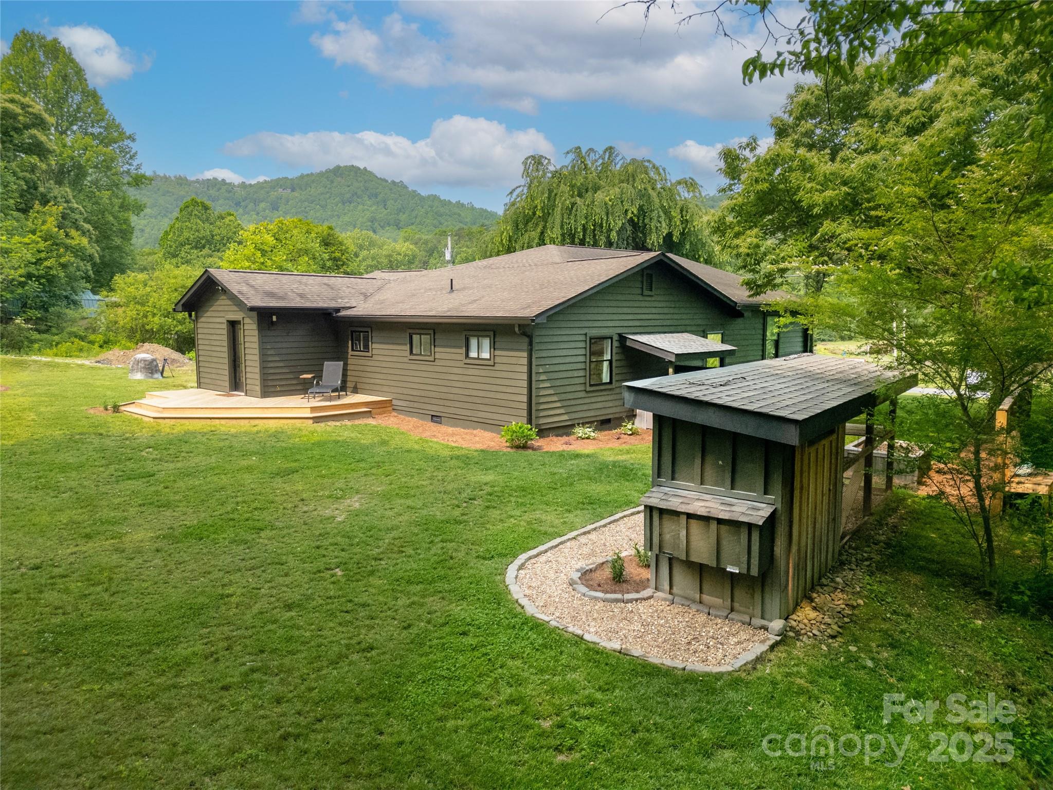 903 Middlefork Road Brevard, NC 28712 - Photo 41 of 45 a view of a house with a yard patio and sitting area