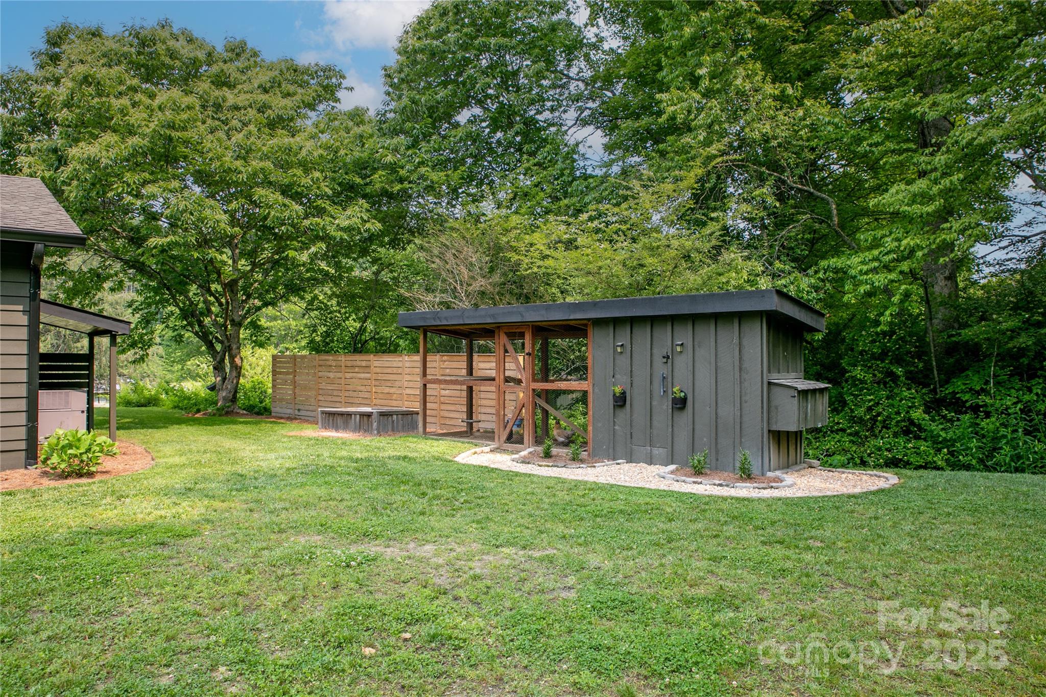 903 Middlefork Road Brevard, NC 28712 - Photo 43 of 45 a backyard of a house with table and chairs