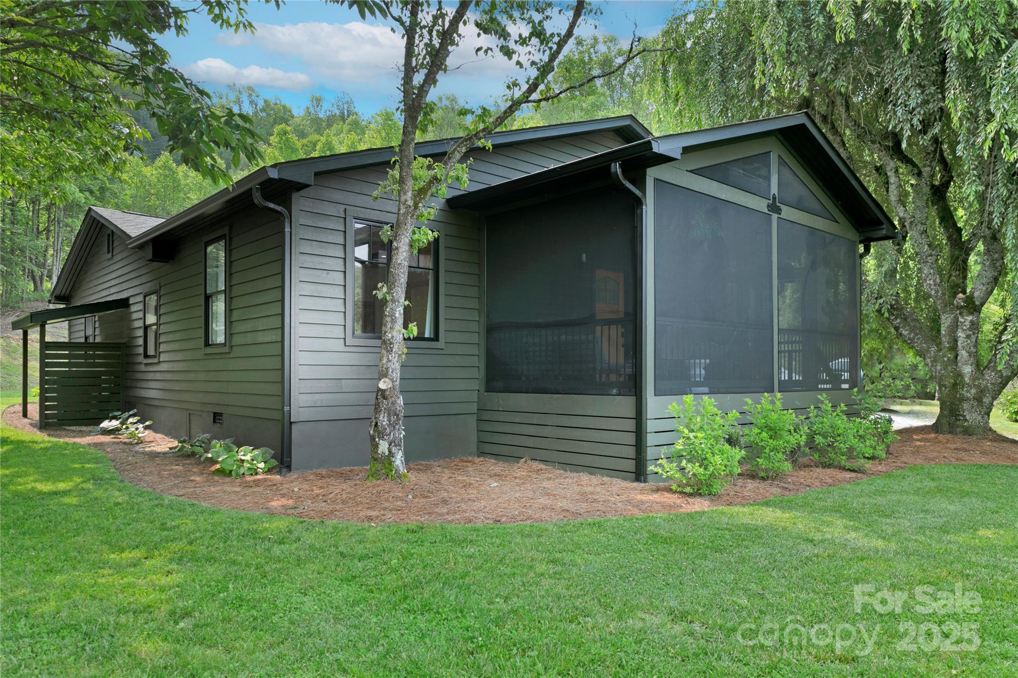 903 Middlefork Road Brevard, NC 28712 - Photo 45 of 45 a view of a wooden house with a small yard