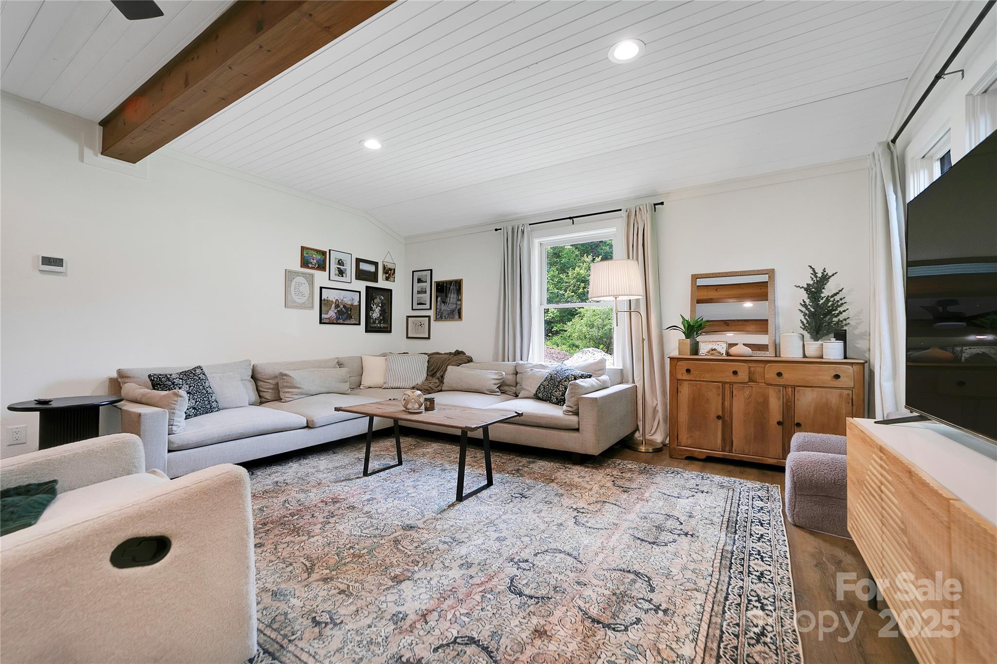 903 Middlefork Road Brevard, NC 28712 - Photo 5 of 45 a living room with furniture wooden floor and a flat screen tv