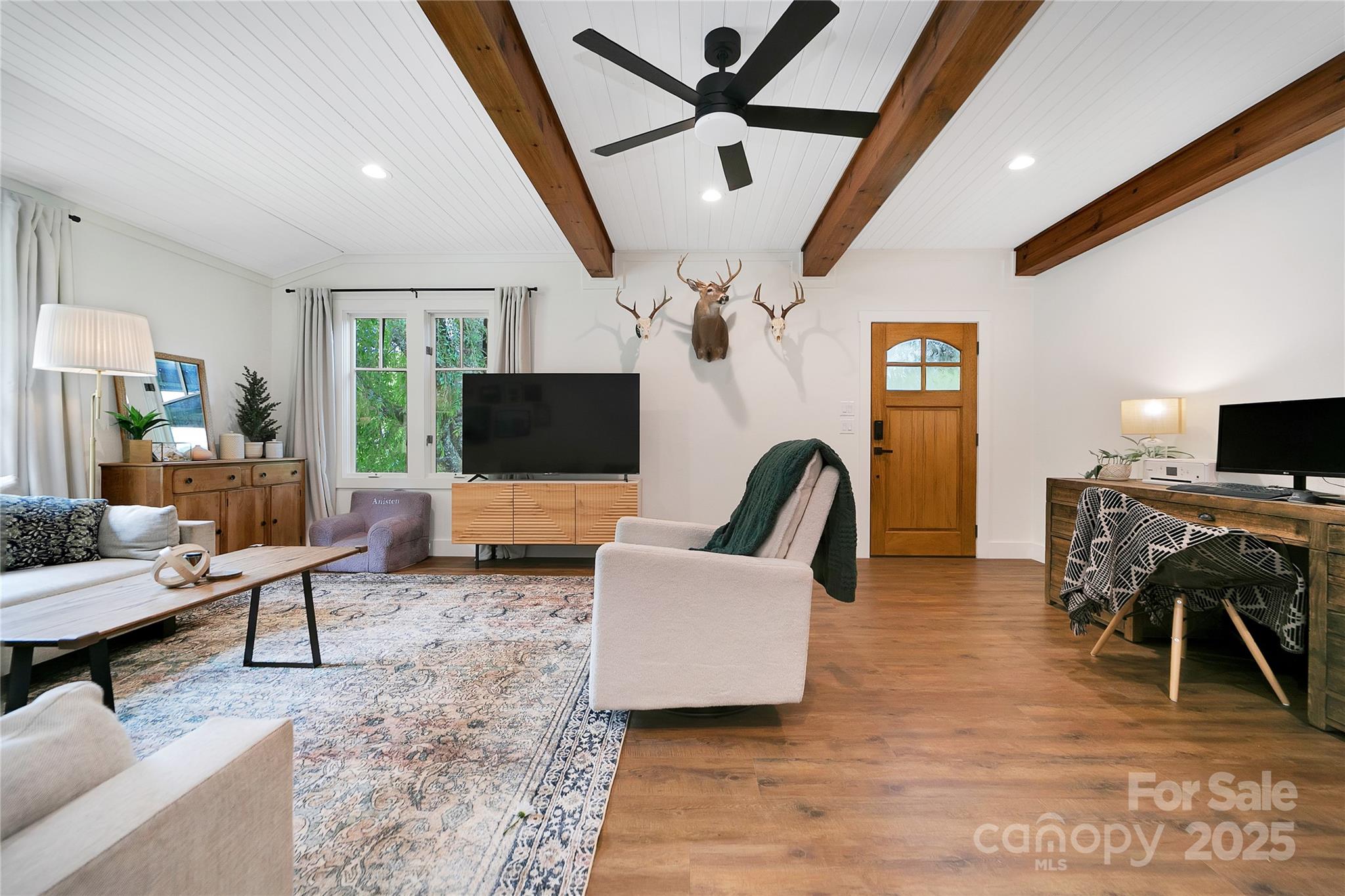 903 Middlefork Road Brevard, NC 28712 - Photo 8 of 45 a living room with furniture a flat screen tv and a table