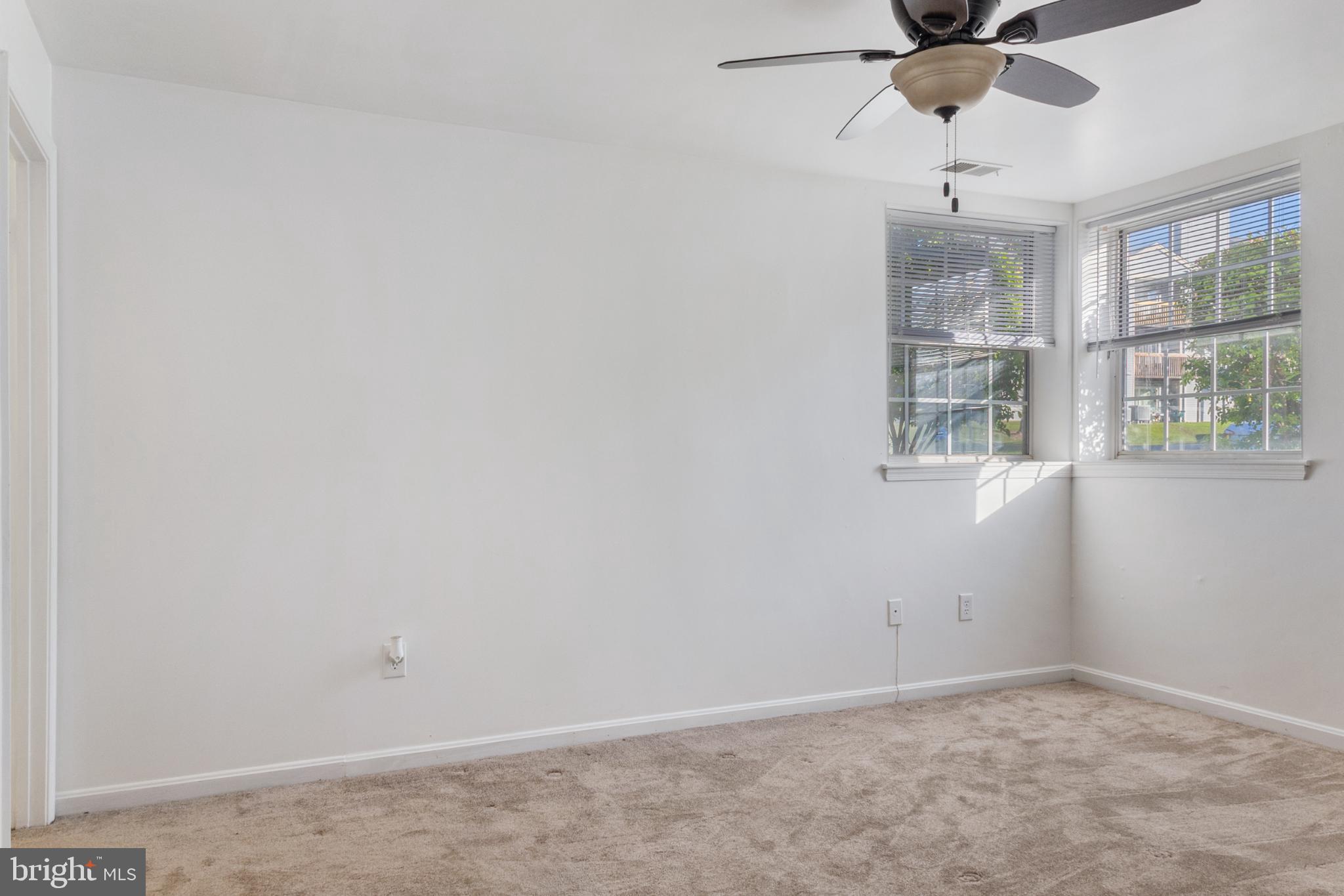 103 Three Coin Way, Unit 104 Glen Burnie, MD 21060 - Photo 13 of 19 an empty room with a window