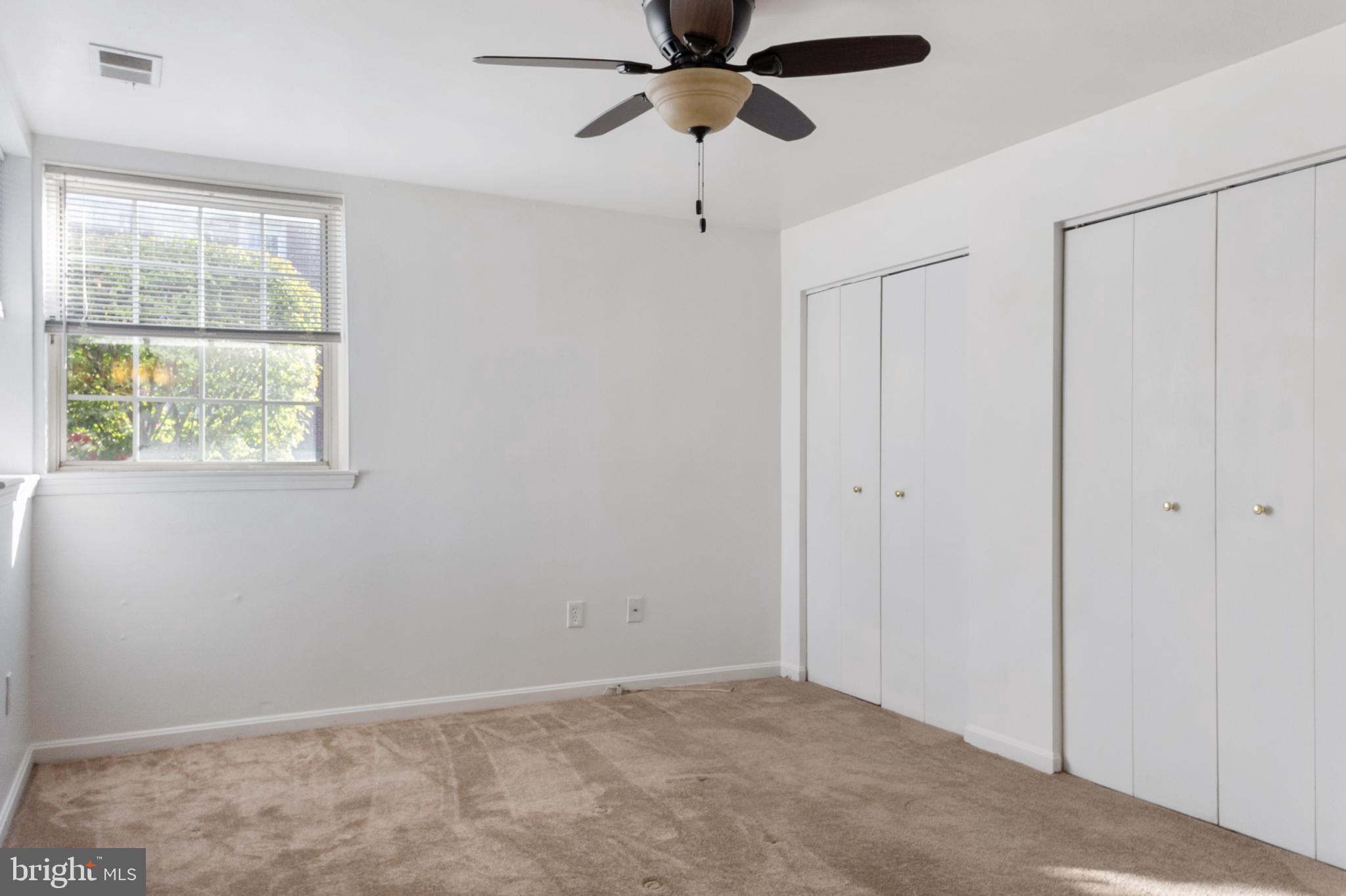 103 Three Coin Way, Unit 104 Glen Burnie, MD 21060 - Photo 14 of 19 a view of an empty room with a window