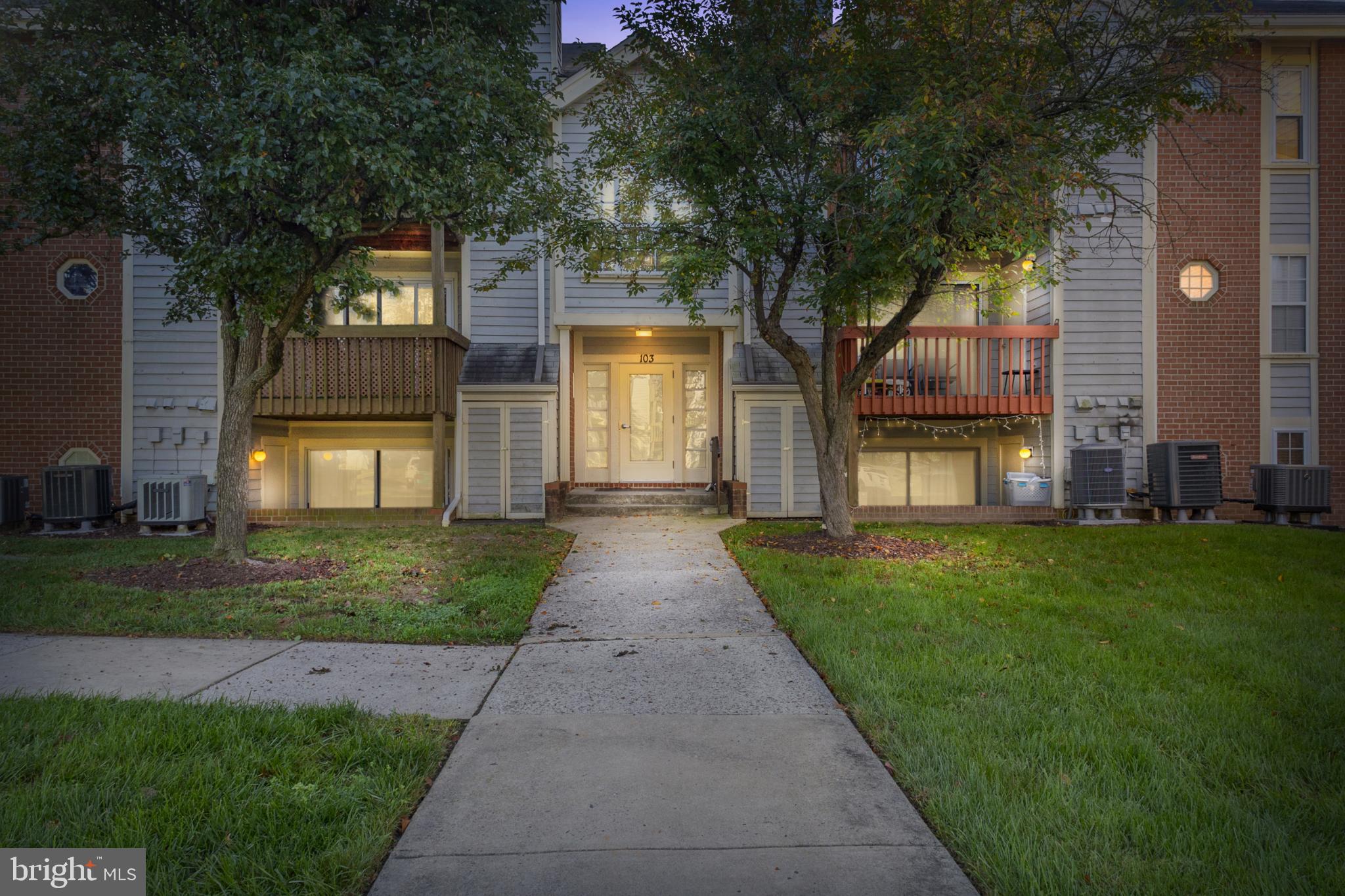 103 Three Coin Way, Unit 104 Glen Burnie, MD 21060 - Photo 19 of 19 a front view of a house with garden