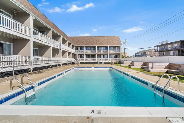 a backyard with a table and chairs