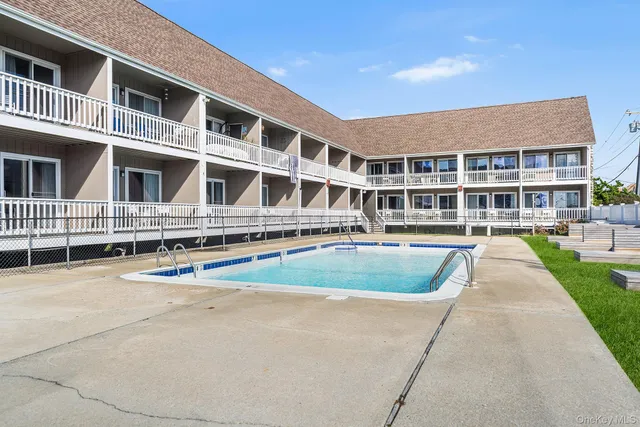 a front view of residential houses with yard