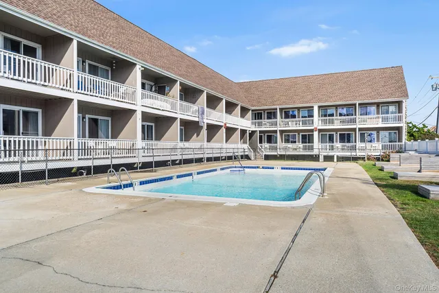 a front view of residential houses with yard