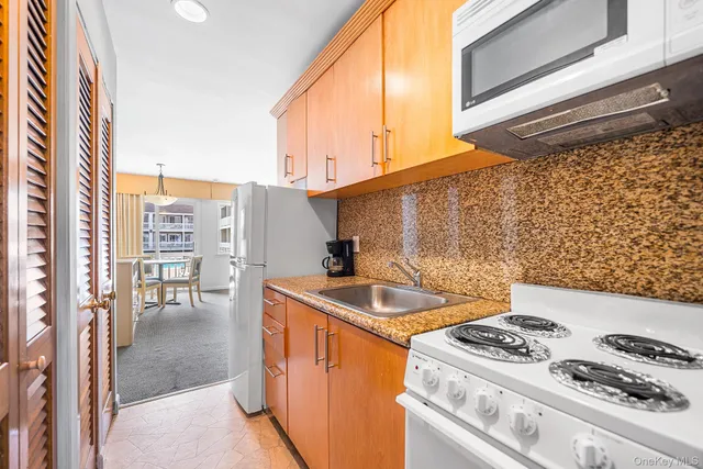 a kitchen with a stove and a sink