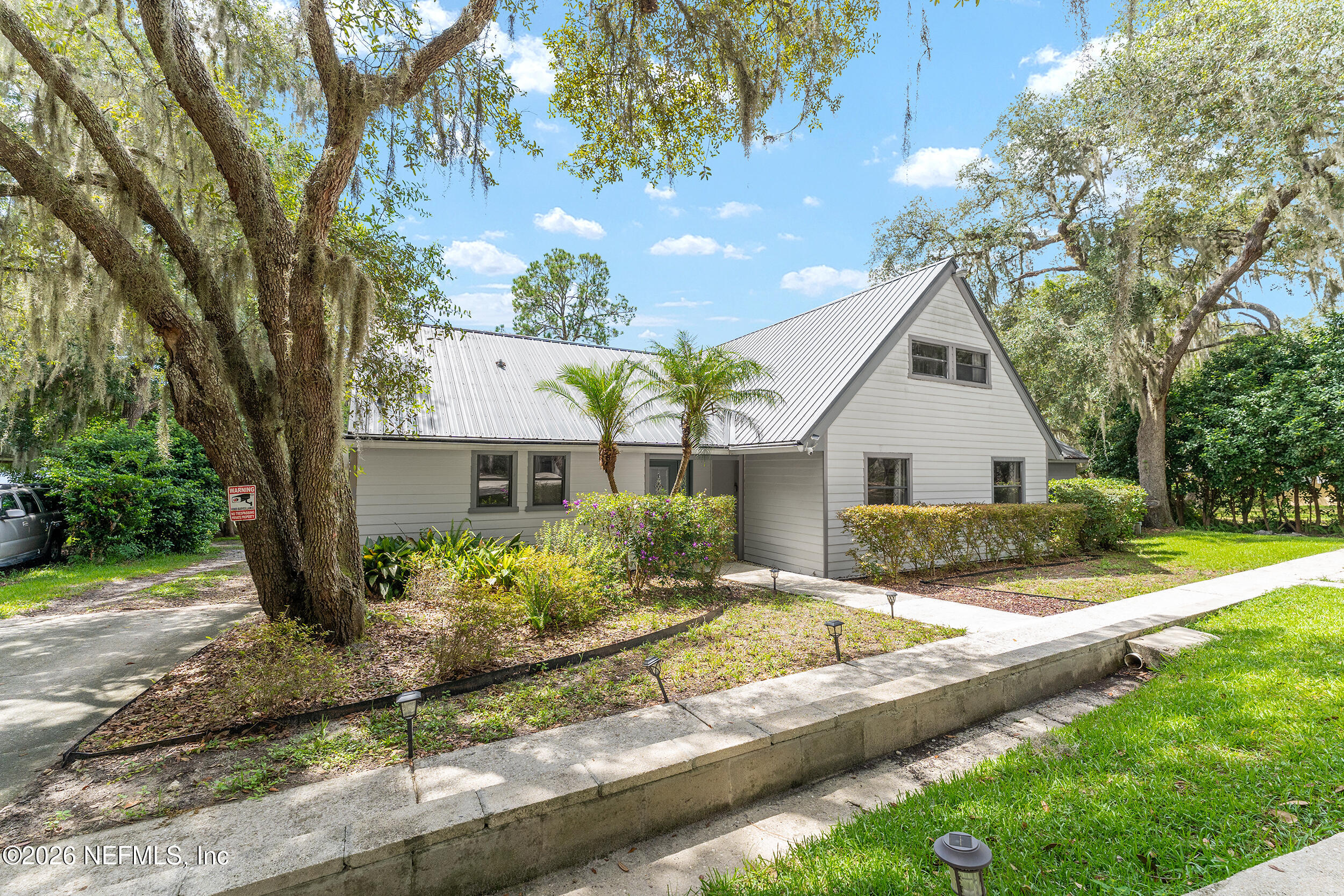 198 Lake Ray Road Hawthorne, FL 32640 - Photo 3 of 78 a view of a house with yard and tree s