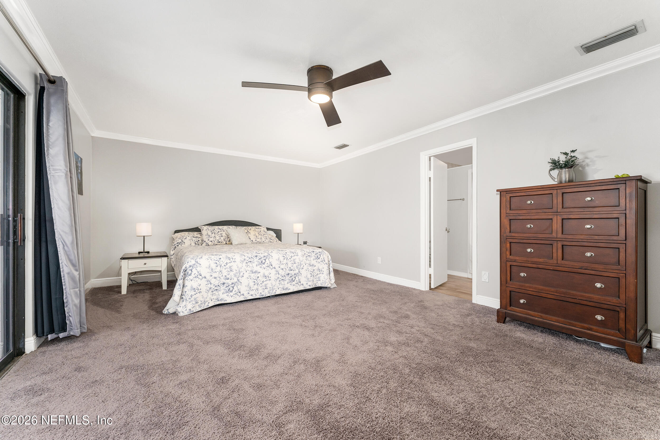 198 Lake Ray Road Hawthorne, FL 32640 - Photo 33 of 78 a bedroom with a bed and a dresser