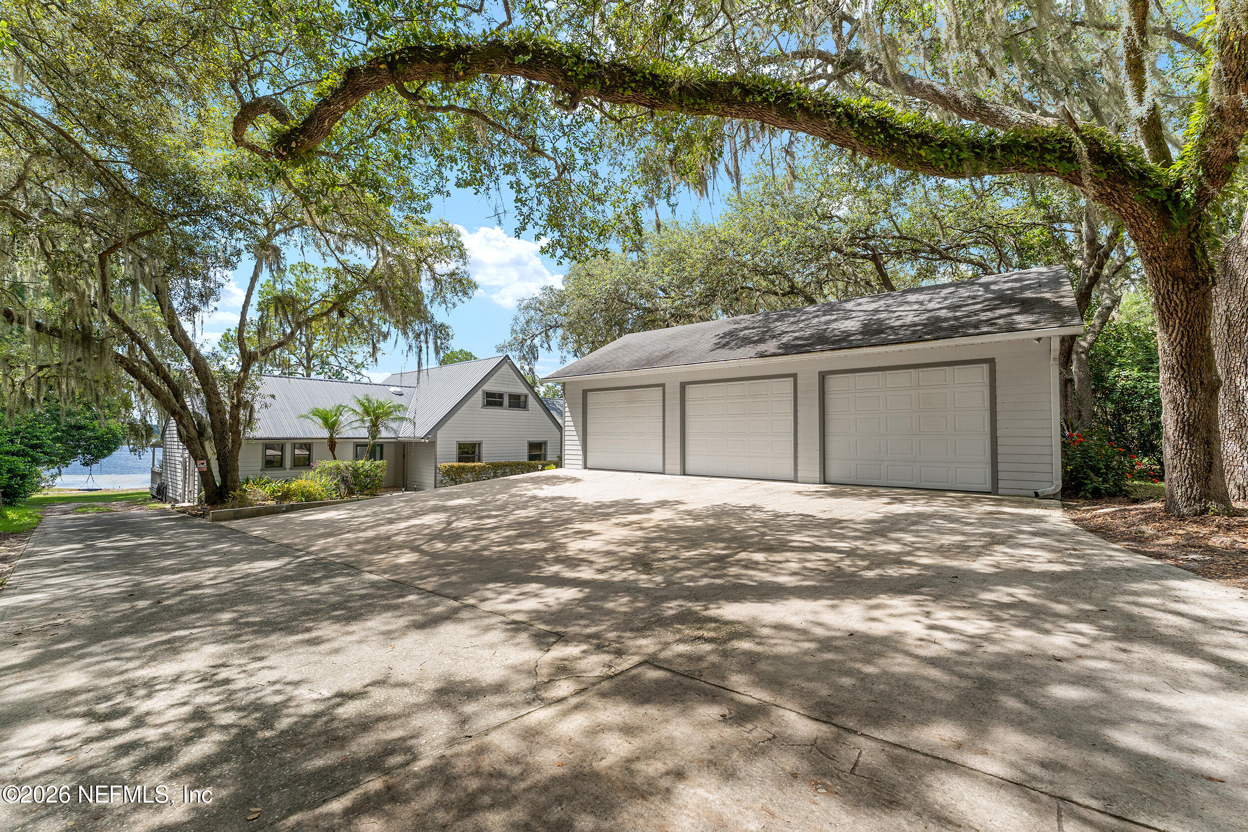 198 Lake Ray Road Hawthorne, FL 32640 - Photo 5 of 78 a view of a house with a yard and large tree
