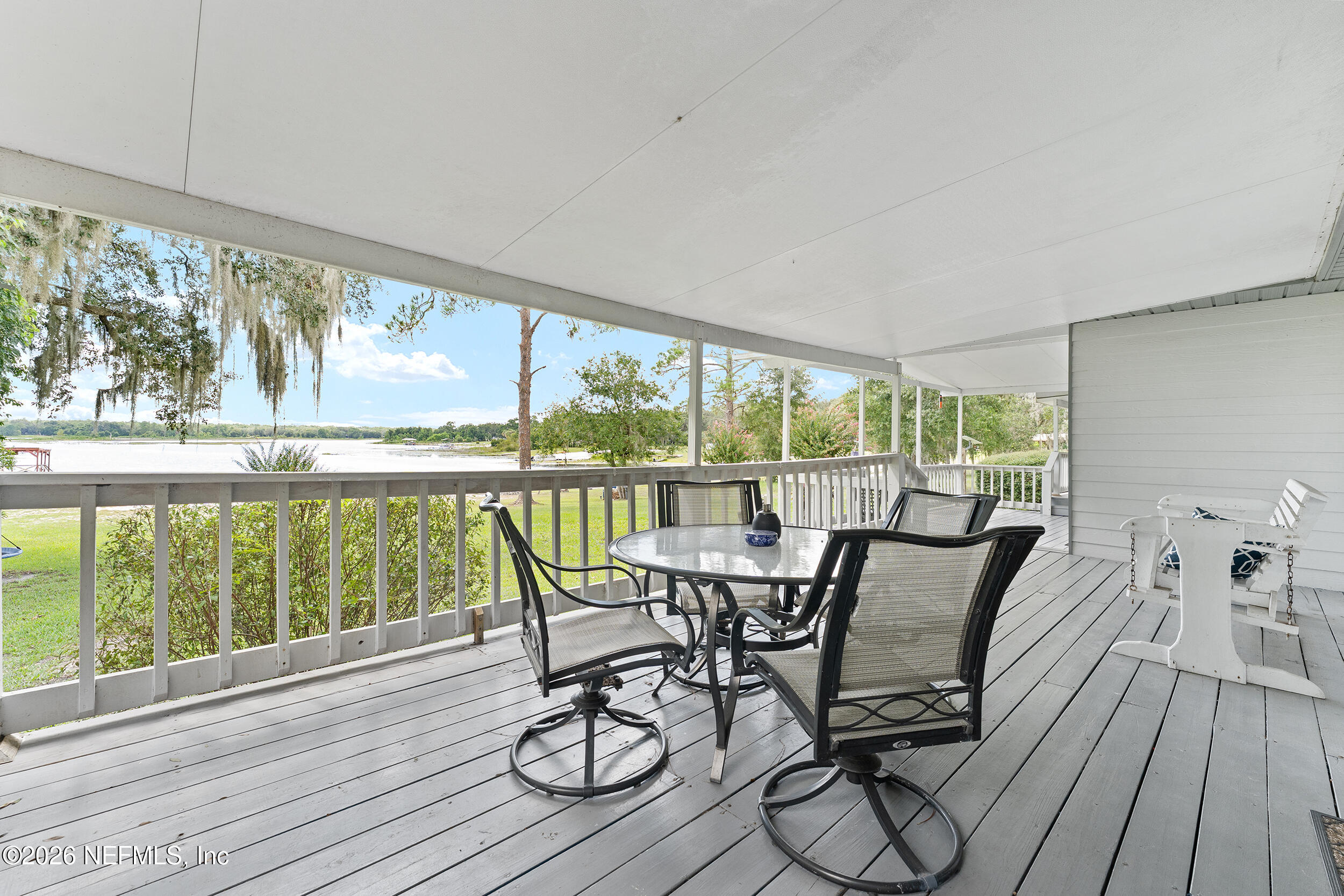 198 Lake Ray Road Hawthorne, FL 32640 - Photo 55 of 78 a view of a dining room with furniture window and wooden floor