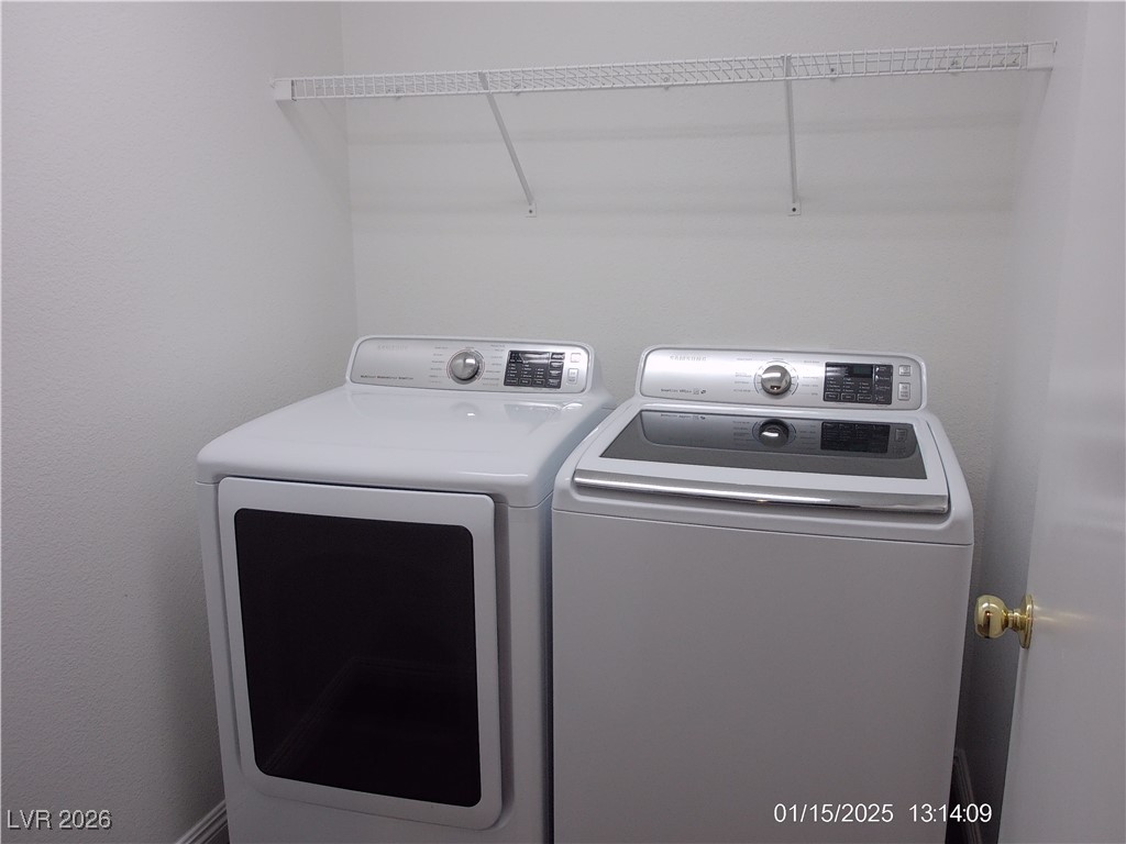 7332 Ribbon Ridge Avenue Las Vegas, NV 89129 - Photo 19 of 28 Laundry area with washer and dryer