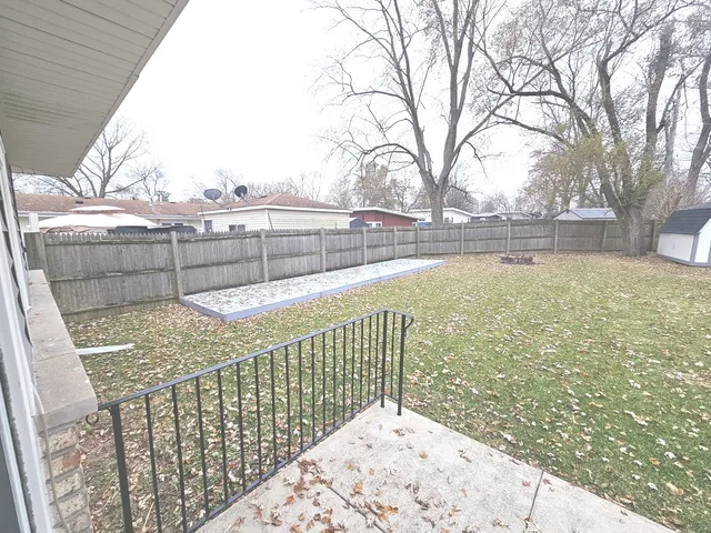 a view of roof with wooden fence