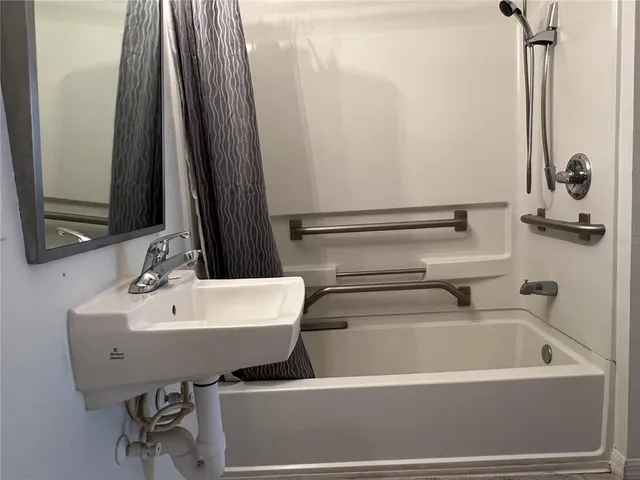 a bathroom with a sink and a mirror