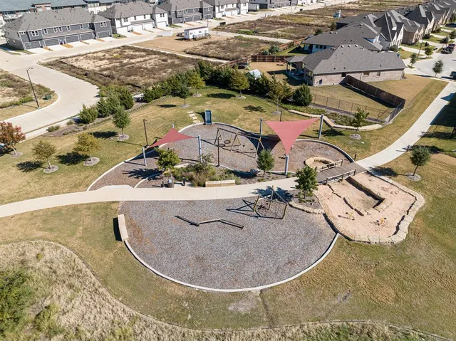 an aerial view of a house with outdoor space