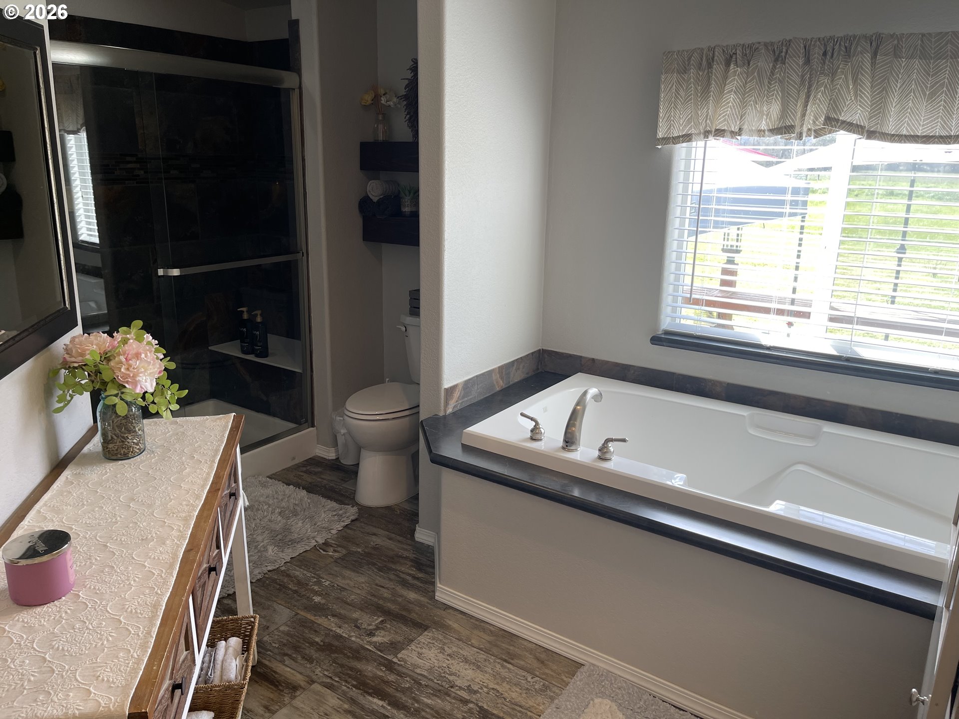 6404 Lookingglass Road Roseburg, OR 97471 - Photo 21 of 48 a bathroom with a bathtub and a sink