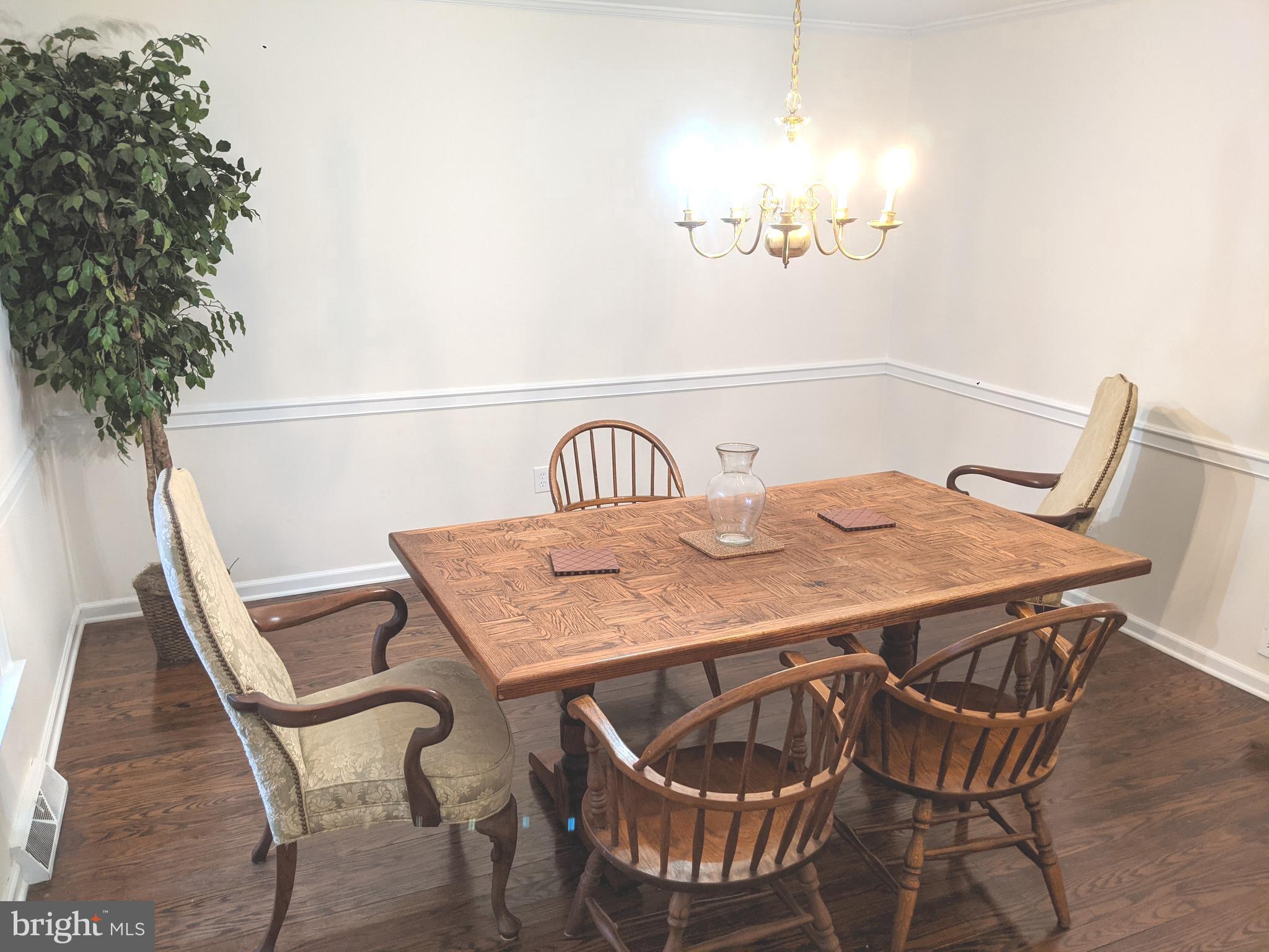 611 Andover Road Newtown Square, PA 19073 - Photo 12 of 27 a view of a dining room with furniture and wooden floor