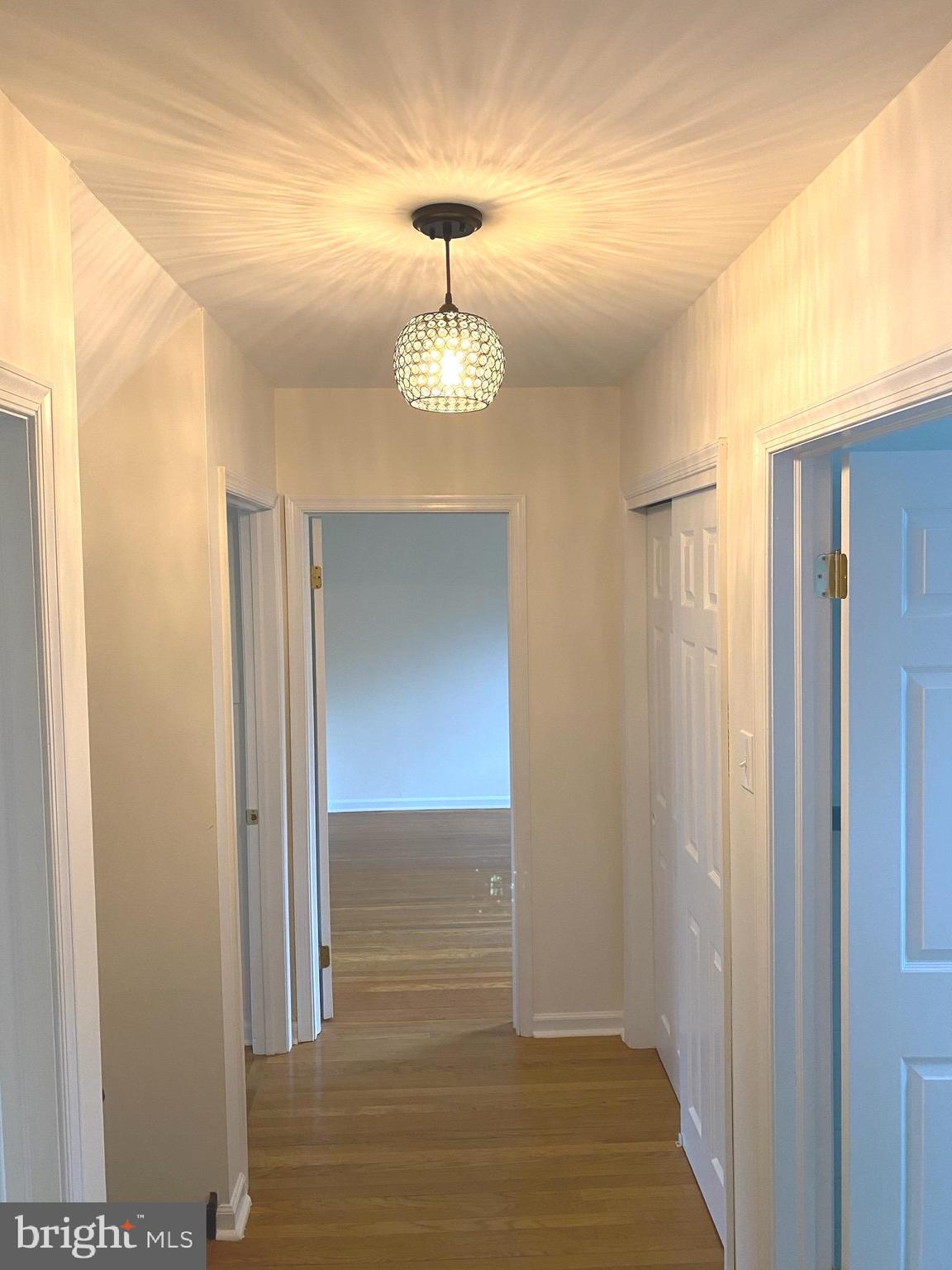 611 Andover Road Newtown Square, PA 19073 - Photo 15 of 27 a view of a hallway with wooden floor