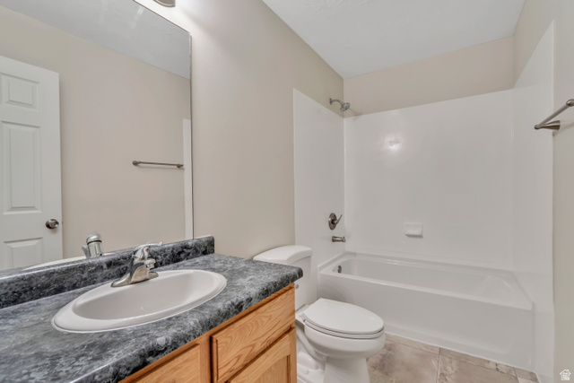 1118 North Ridge Court Spanish Fork, UT 84660 - Photo 20 of 32 Bathroom with vanity, bathing tub / shower combination, and light tile patterned flooring