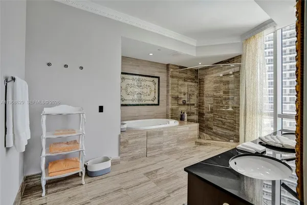 a kitchen with granite countertop a sink stove and refrigerator