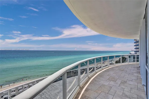 a view of a balcony with ocean view