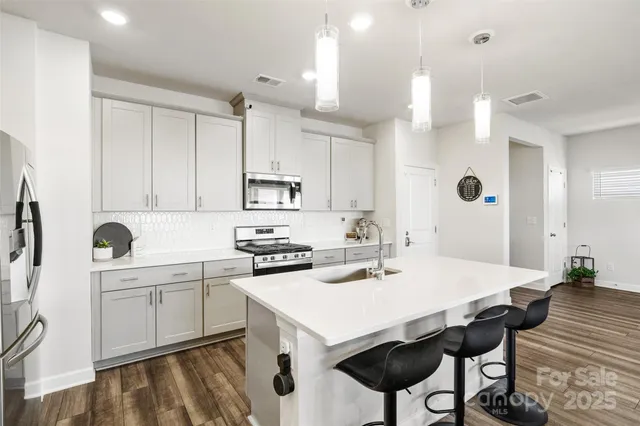 a very nice looking room with a large kitchen