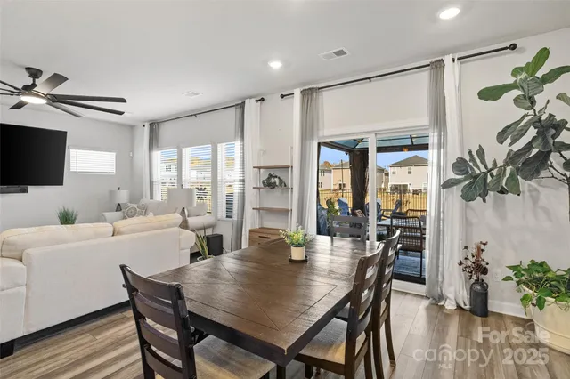 a living room with fireplace furniture and a flat screen tv
