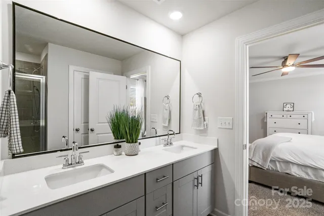 a bathroom with a glass shower door