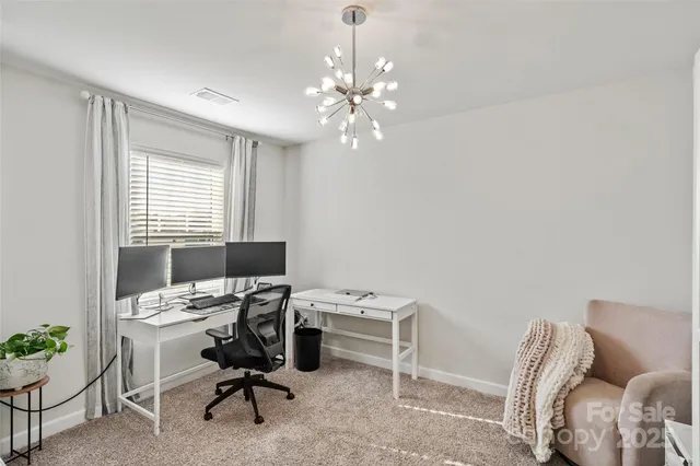 a room with furniture and a chandelier