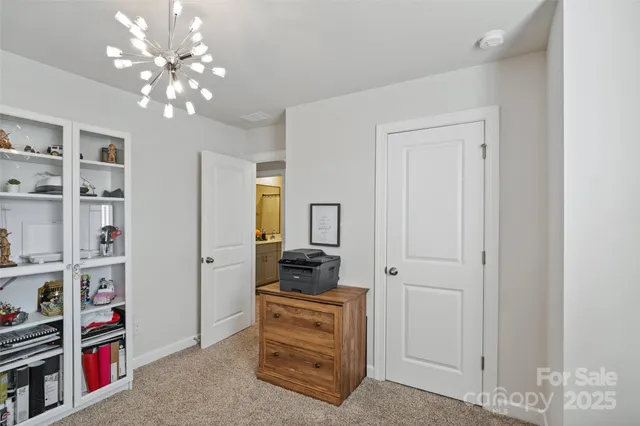 a bathroom with a sink toilet a mirror and shower