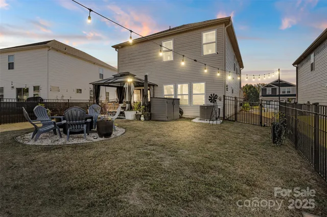 a view of a patio with table and chairs