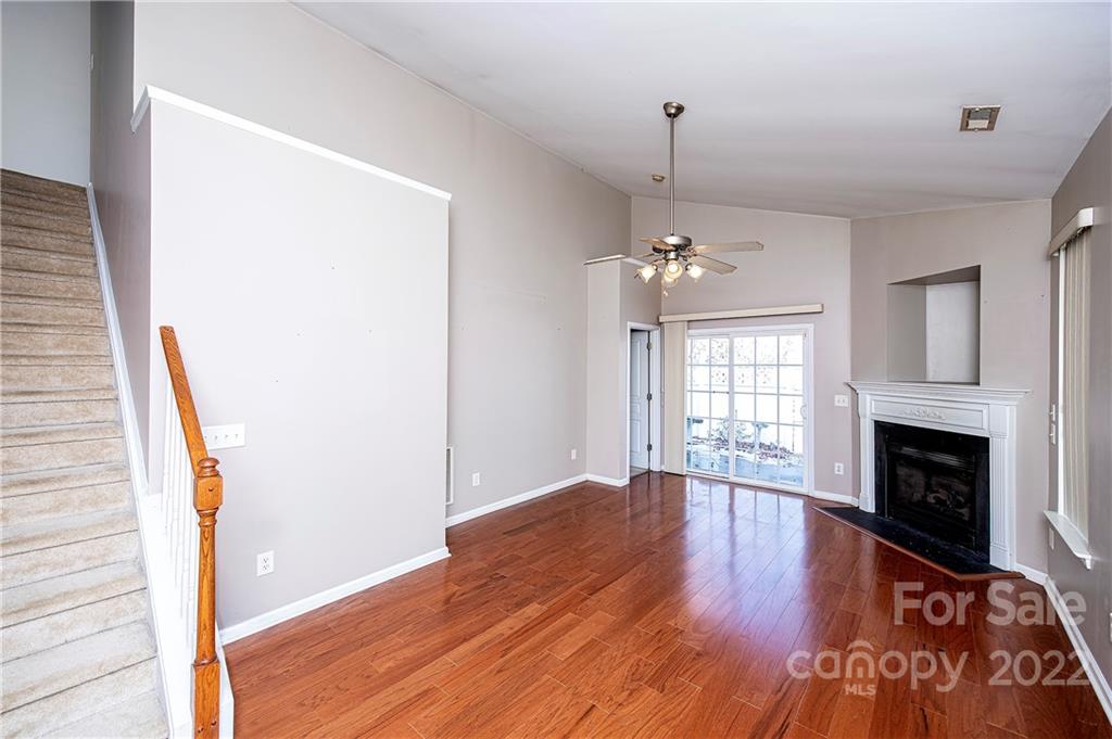 949 Copperstone Lane, Unit 203 Fort Mill, SC 29708 - Photo 2 of 19 a furnished livingroom with windows and fireplace