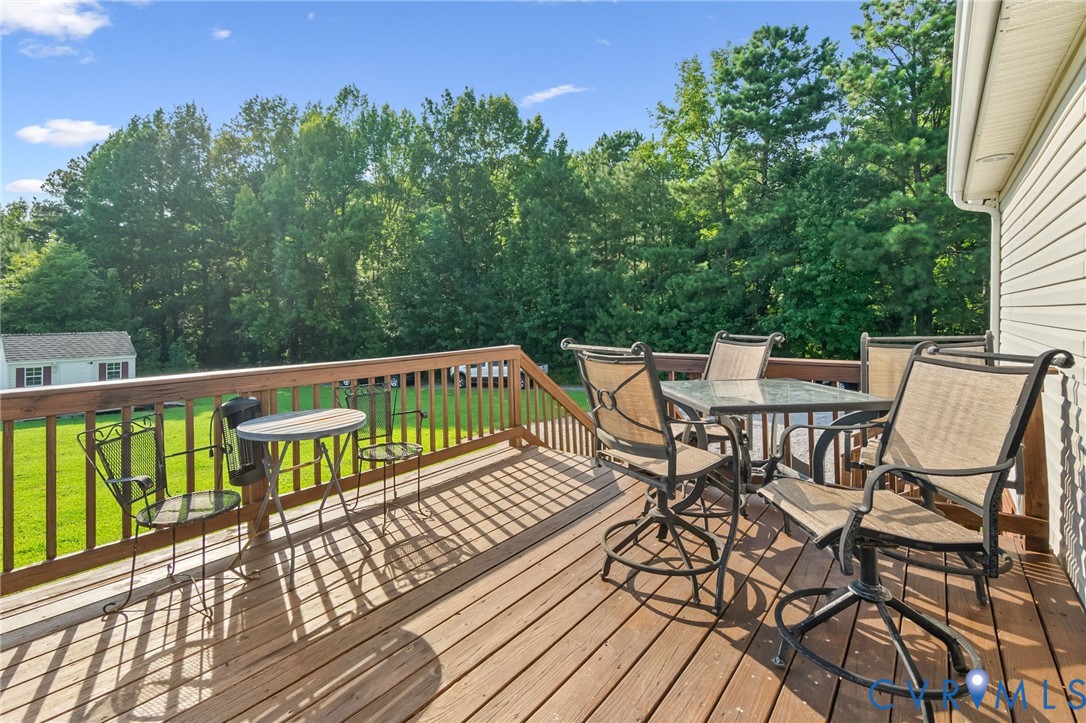 10910 Courthouse Road Dinwiddie, VA 23841 - Photo 29 of 38 Wood-finish deck with a wood railing and white vin