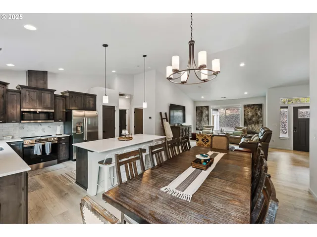 a living room with lots of furniture and kitchen view