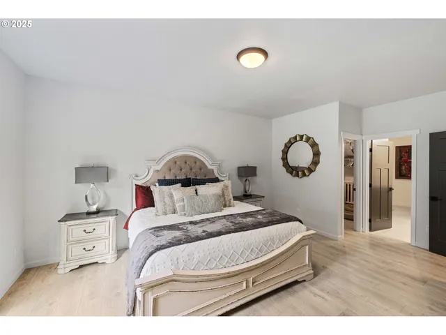 a bedroom with a bed and cabinets