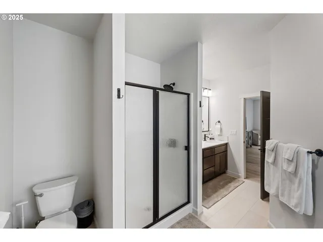 a bathroom with a shower and a toilet