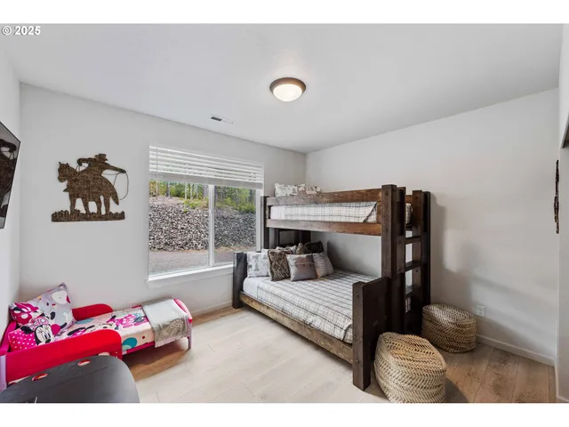 a bedroom with furniture and a window