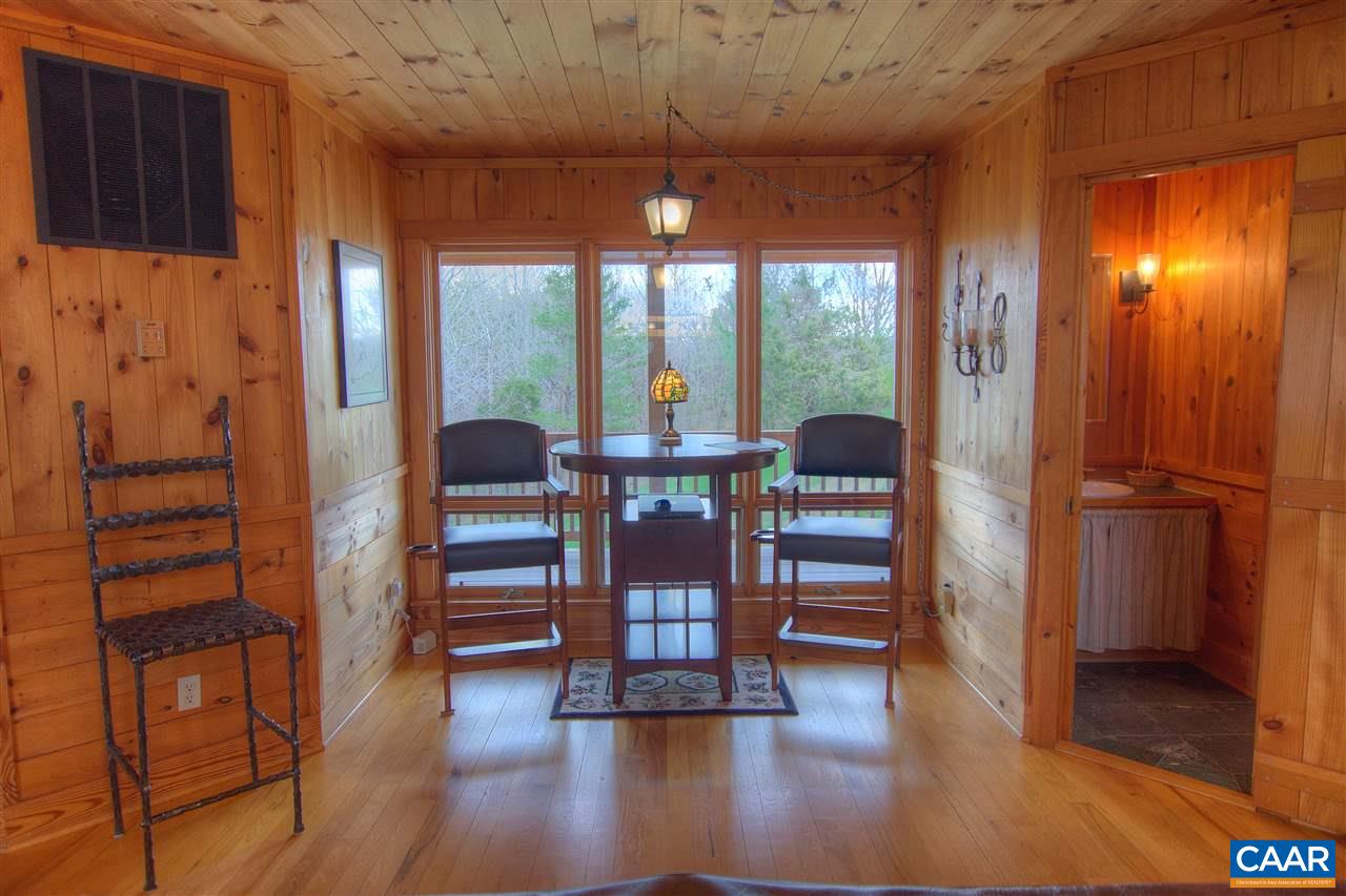 264 Twin Ridge Lane Afton, VA 22920 - Photo 14 of 49 a living room with furniture and a floor to ceiling window