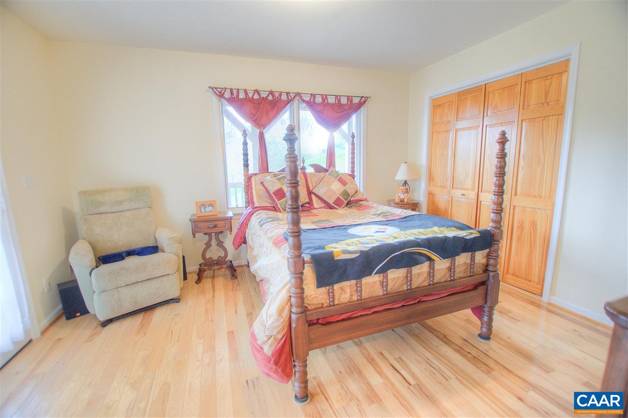 264 Twin Ridge Lane Afton, VA 22920 - Photo 22 of 49 a bedroom with a bed and a table